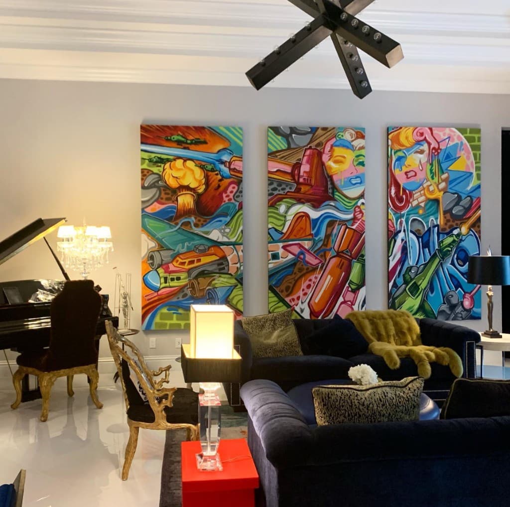 Large colorful graffiti canvas artworks by Bulk Styles displayed as modern wall decor in a living room