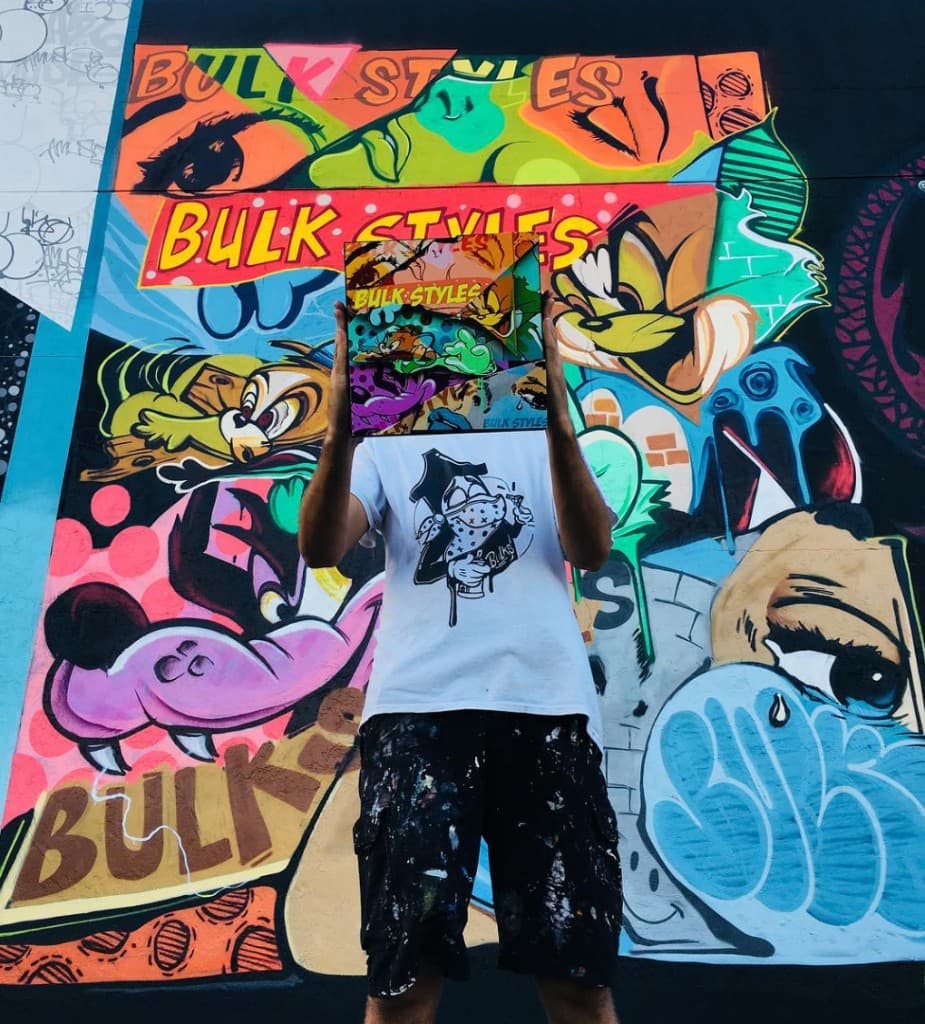 Bulk Styles mural with artist