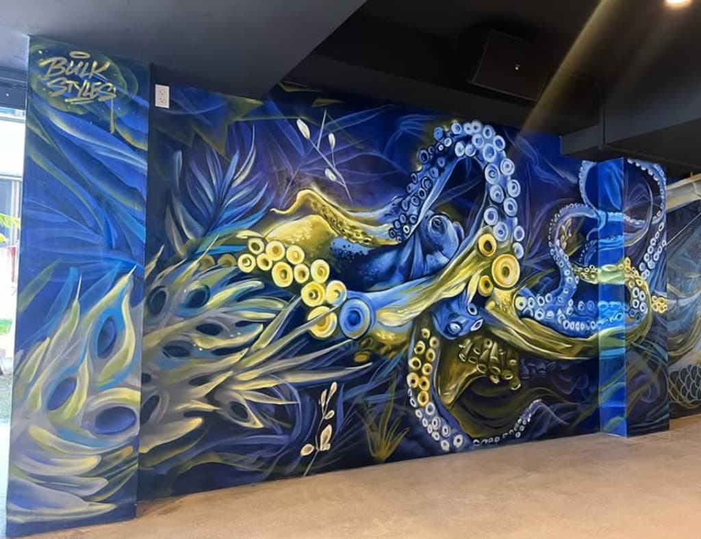 Large underwater octopus mural painted by Bulk Styles